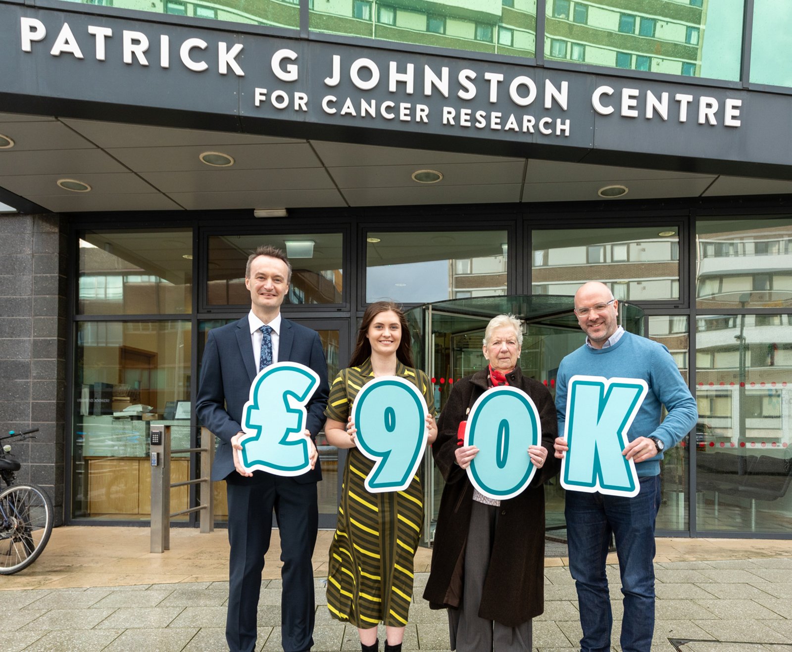 Susie Kennedy receives the Dr Jim Birnie Fellowship to study immunotherapy in oesophageal cancer, thanks to a £90k donation from the Birnie family to Cancer Focus NI. Pictured left to right: Research supervisor Dr Richard Turkington, Susie Kennedy, Ruth Birnie and Chief Executive of Cancer Focus NI, Richard Spratt.